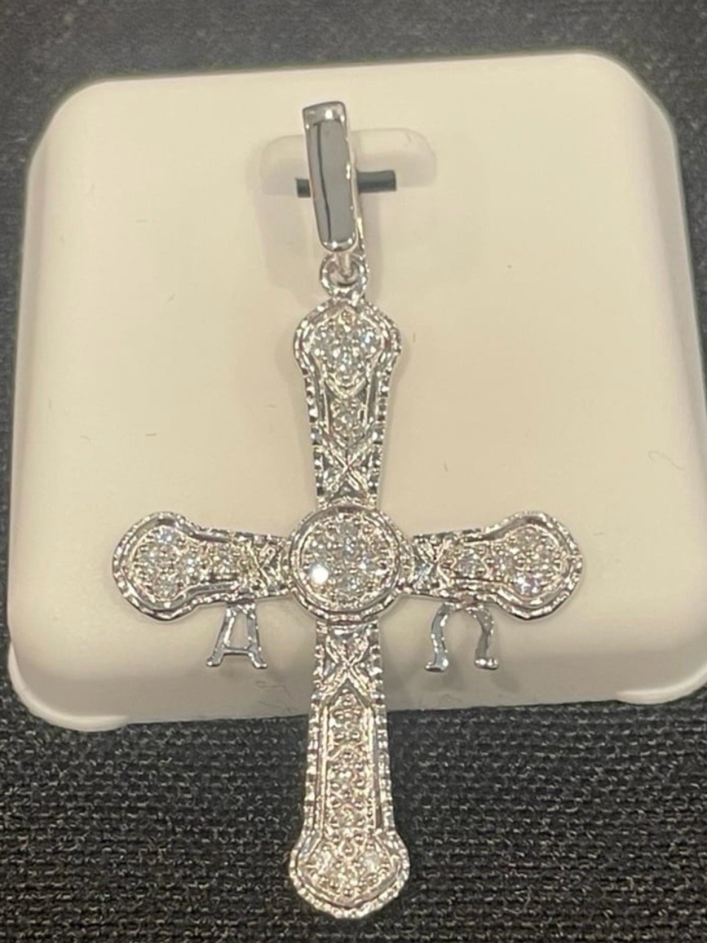 Rhodium plated over 925 silver 0.75ctw Moissanite cross pendant
